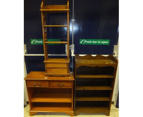 A modern yew wood book case with two drawers over adjustable shelves, a small rubberwood book shelf, a small oak bookcase and