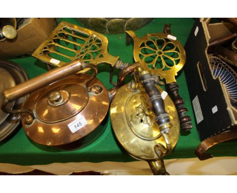 A collection of various metalware to include copper kettle, brass kettle, two brass trivets, brass gong and beater, copper la