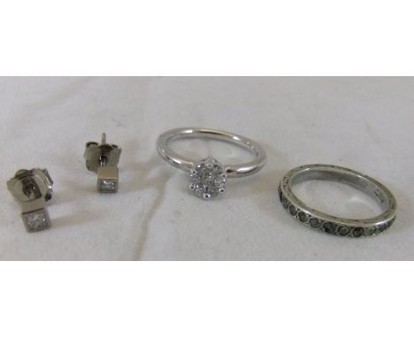 A 9ct white gold diamond set dress ring, together with a pair of white metal mounted diamond set earrings, and a silver and m