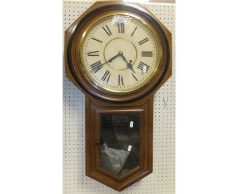 A circa 1900 walnut cased American drop dial wall clock by The Ansonia Clock Co., New York, bears label to interior