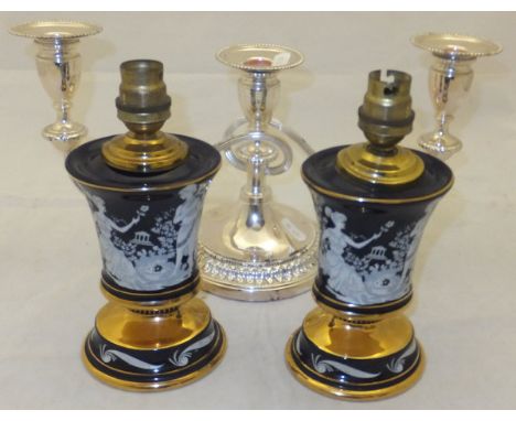 A pair of small Italian table lamp bases decorated in the classical taste, together with a plated three branch candelabra