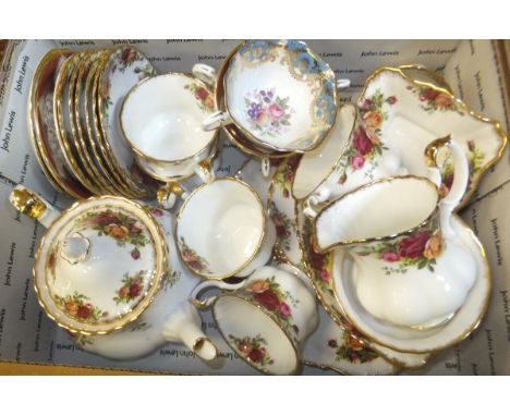 A box containing a collection of Royal Albert "Old Country Roses" pattern teawares to include  teapot, cups and saucers, milk