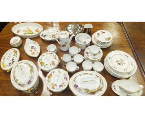 A collection of Royal Worcester "Evesham" pattern tablewares to include lidded tureens, serving dishes, ramekin, coffee pot, 