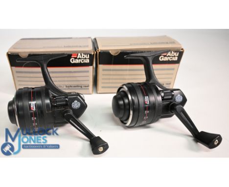 A pair of Abu Diplomat 844M close faced graphite reels, side roller tensioners, both with spare spools in original boxes with