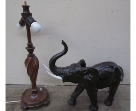 A pottery elephant together with a turned oak table lamp