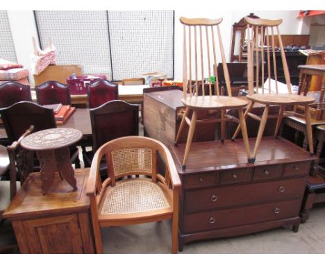 A hardwood pot cupboard together with a carved and inlaid wine table, a hardwood bergere elbow chair, a pair of Ercol stick b