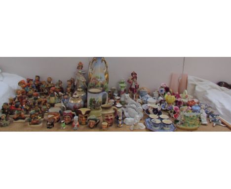 Numerous Hummel figures together with continental figures, twin handled vases, floral encrusted baskets, glass vases etc