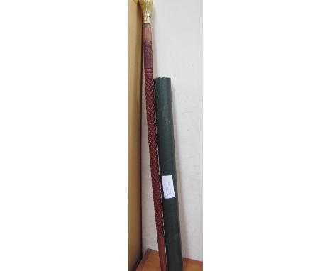 A walking stick with brass fittings and flask end together with a 1919 copy of the times