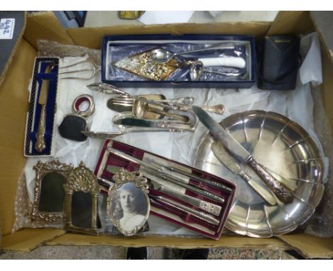 A collection of metalware items to include silver handles knife, silver and Mother-of-Pearl pickle fork, silver plated items 