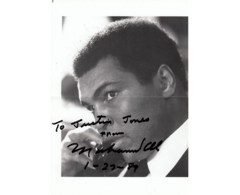 MUHAMMAD ALI AUTOGRAPH   A 7" X 5" black and white portrait photograph dedicated "To Justin Jones from Muhammad Ali 1-27-89".