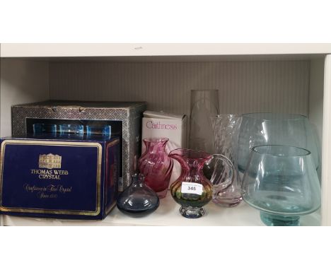 Shelf of art glass includes caithness glass. 