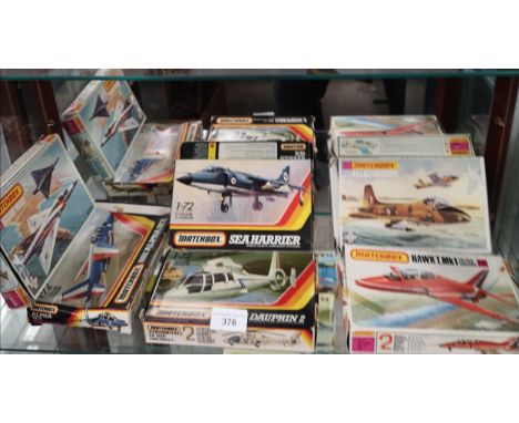 Shelf of matchbox plane models boxed . 