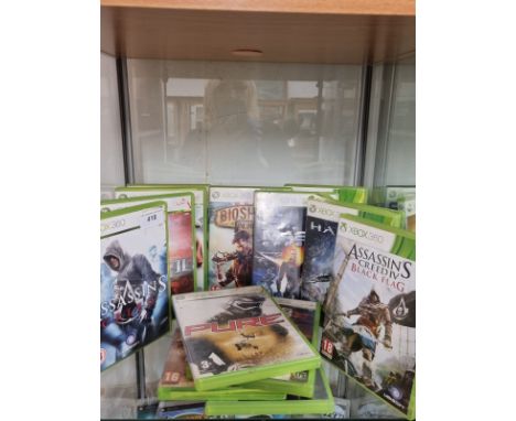 Shelf of xbox 360 games . 