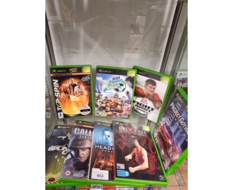 Shelf of Xbox original games . 