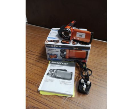 Silver crest camcorder with accessories and box. 