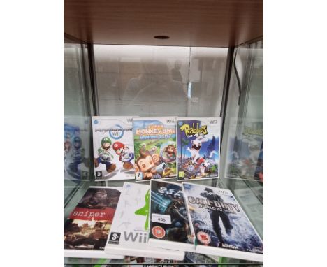 Shelf of Nintendo wii games . 