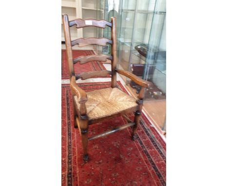 Antique child's ladder back arm Chair. 