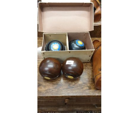 Set of vintage wooden bowling bowls together with set of hensalite bowling bowls. 