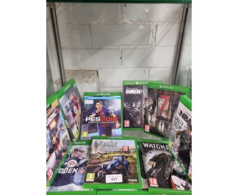 Shelf of Xbox one games . 