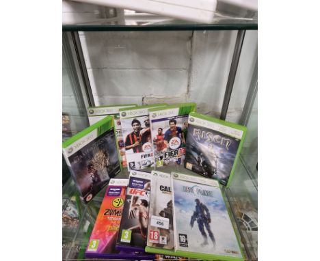 Shelf of xbox 360 games . 