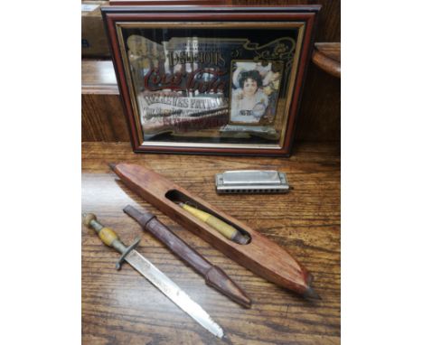 Lot of curiosities to include small dagger, coca cola mirror harmonica and novelty item.. 