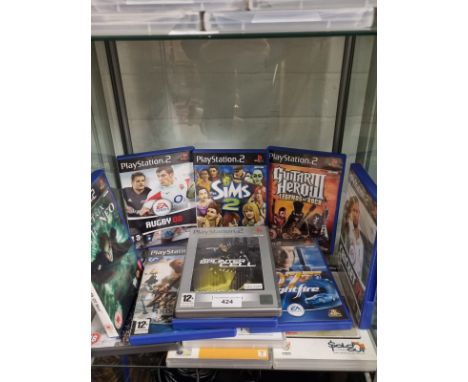 Shelf of playstation 2 games . 