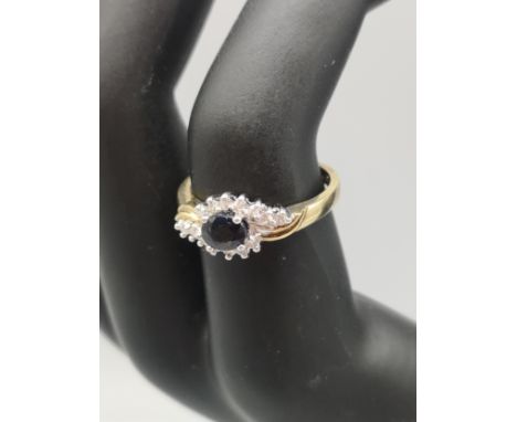 9ct gold diamond and sapphire style set ring . 