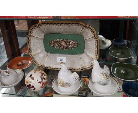 Shelf of collectables includes royal worcester egg holders etc . 