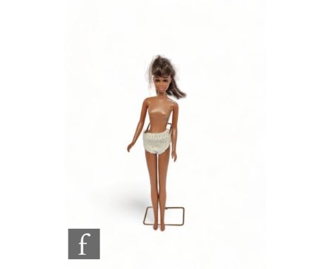 A 1960s Mattel Barbie Francie doll, black with dark brown hair. 