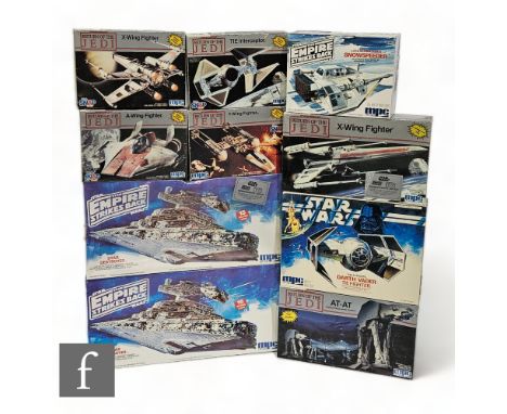 A collection of MPC / ERTL Star Wars plastic model kits, comprising two Star Destroyers, Darth Vader's TIE Fighter, Snowspeed