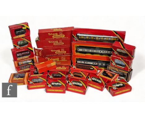 A collection of assorted OO gauge Hornby, Triang and Bachmann rolling stock, to include mostly wagons, vans and coaches, all 