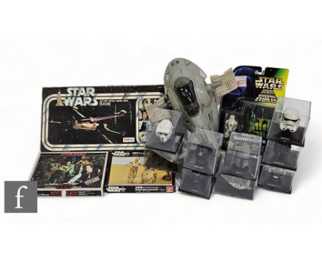 A collection of Star Wars partwork helmet and vehicles, together with a vintage Kenner Slave 1 unboxed starship, Palitoy Esca