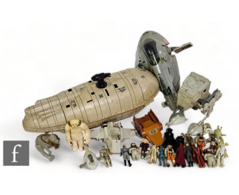 A collection of vintage Kenner Star Wars toys, to include Slave I, Rebel Transport, AT-ST, Wampa, Tauntaun, and a selection o