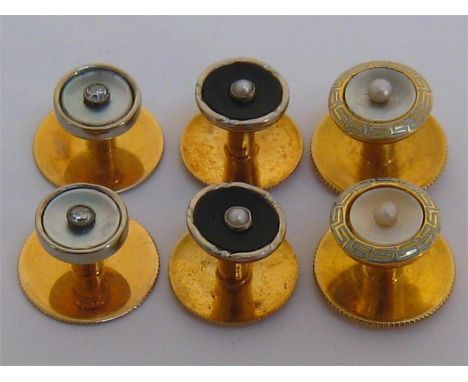 Three pairs of Art Deco 18 carat gold circular studs, including one of enamel, seed and mother of pearl 8.7mm diameter, one o
