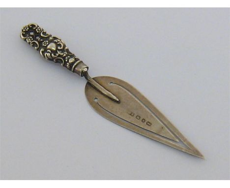 A late Victorian silver trowel bookmark by Levi and Salaman, Birmingham, 1899, with ornate embossed pierced handle. Condition