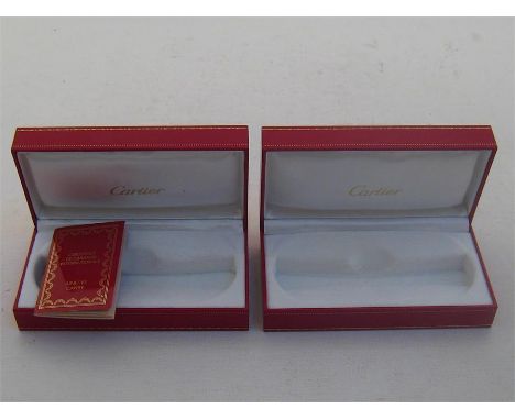Two Cartier sunglass boxes, in red leather, together with a guarantee leaflet 

