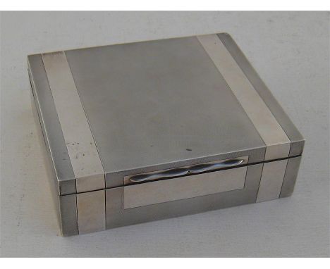 A silver cigarette box by William Base & Sons, Birmingham, 1929, engine turned on all faces with two plain bands and vacant f