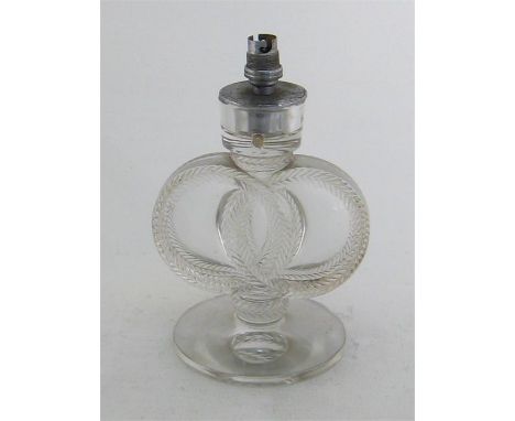 A Lalique glass table lamp in the form of two interlinked laurel rings standing on a circular base and supporting a chromium 