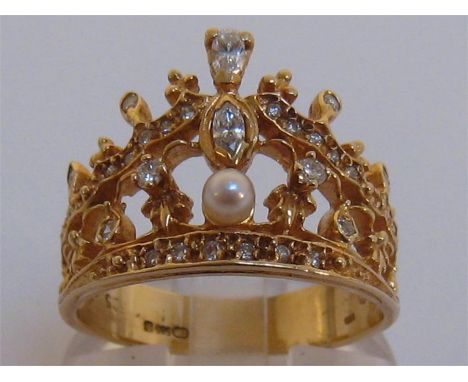 A 14 carat gold, diamond and cultured pearl ring, designed as a diadem, the central small pearl 3.1mm, the shank import marke