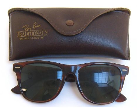 A pair of 1980s RayBan ‘Traditionals’ sunglasses, with tortoiseshell frames, in original leather case with ticket and cleanin