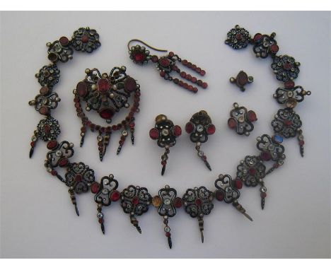 A late 19th century Austro-Hungarian silver, enamel, paste and gem set necklace, composed of black and white enamel open work