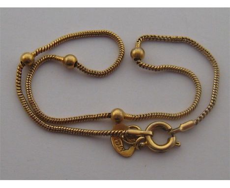An Italian 18 carat gold bracelet, the fine twist link chain set at intervals with four small beads, to a bolt ring clasp, st