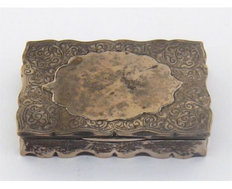 A late Victorian silver snuff box by William Neale, Chester, 1895, engraved all over with scrolling foliage, gilt interior, c