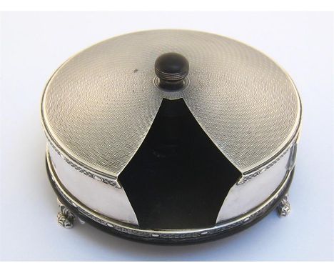 A silver patented match dispenser by Padgett & Braham Ltd., London, 1929, circular with engine-turned top, ovolo and diaperwo