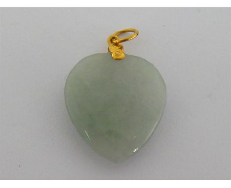 A jade pendant, the heart shaped stone 2.7mm long, with gold fitting and bale (tests 9 carat), 8gms
