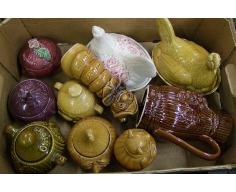 A mixed collection of ceramic items to include; Price and Kensington face pots, ceramic egg, Willy worm money box etc 
