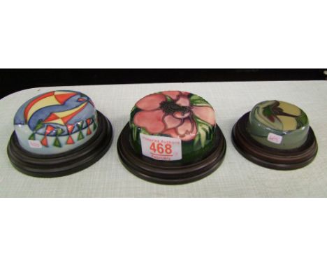 Three Moorcroft paperweights Anemone, Kites and a landscape pattern: first in quality. 