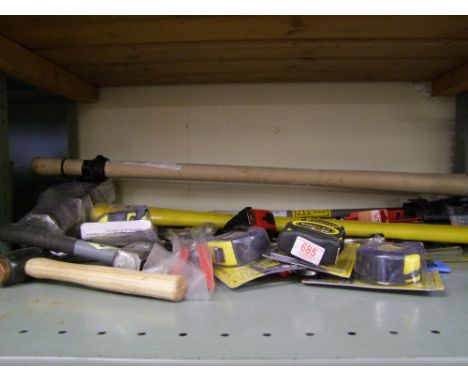 A collection of hand tools: hammers, pliers, tape measures etc. 