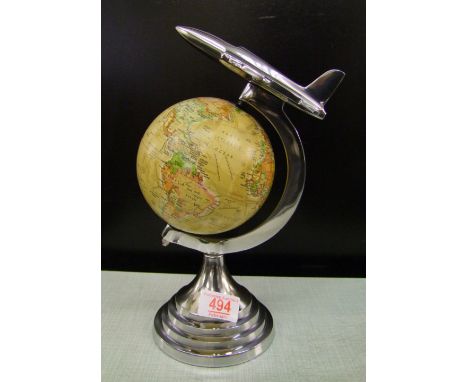 A metal mounted globe with areoplane: 