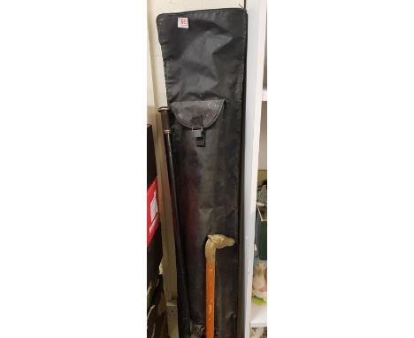 Three fishing rods: together with accessories and rod holdall plus a brass topped walking stick and a long handled boat hook.